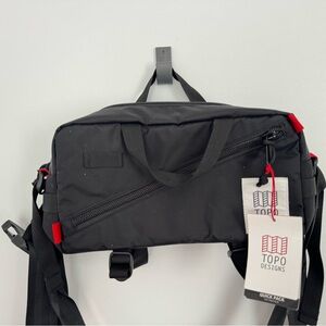 Topo Designs Black Sling Pack with Red Accents